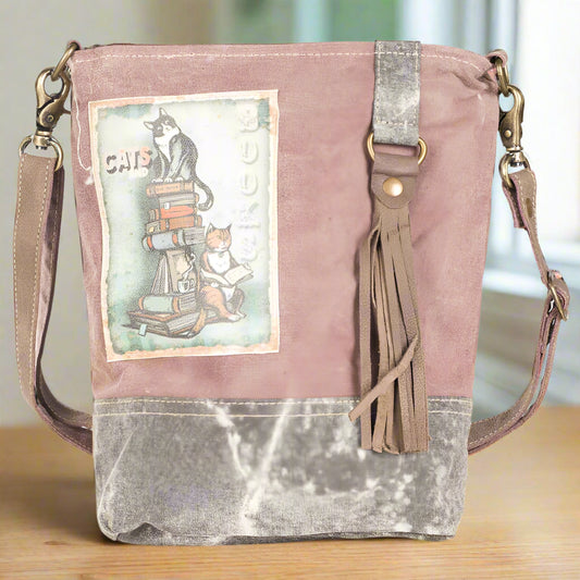 Eco-friendly, fashion forward crossbody bag made from upcycled military tents and leather.